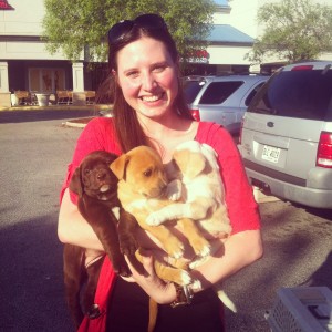 Catie holding puppies